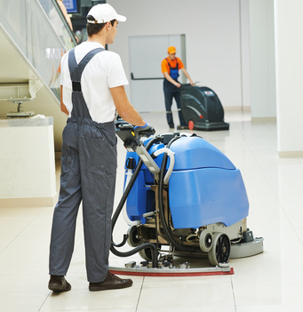 male worker cleaning business hall